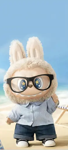 Labubu in glasses, striped shirt, and shorts on sunny sandy beach
