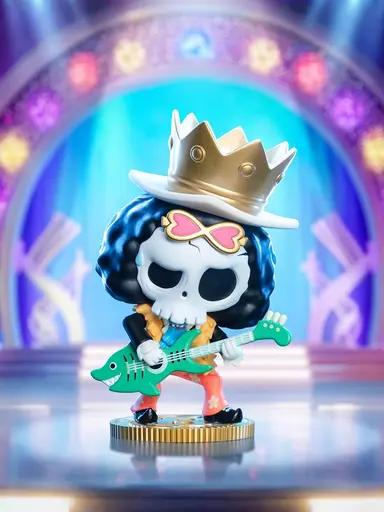 Labubu cosplaying as Brook from One Piece with crown, guitar, and heart sunglasses